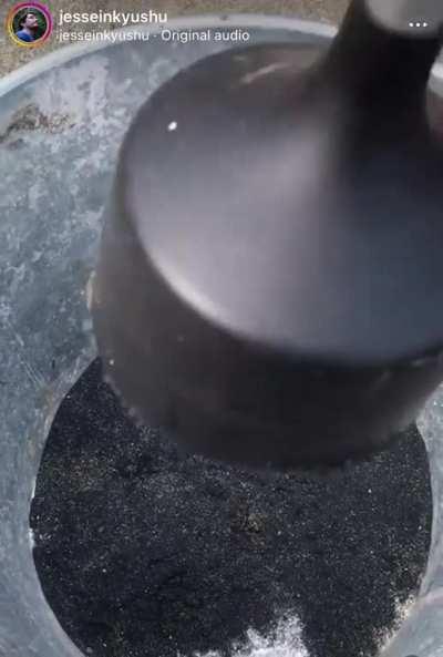 Collecting magnetite on the beach