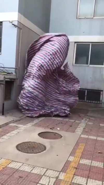 a blanket dancing in the wind