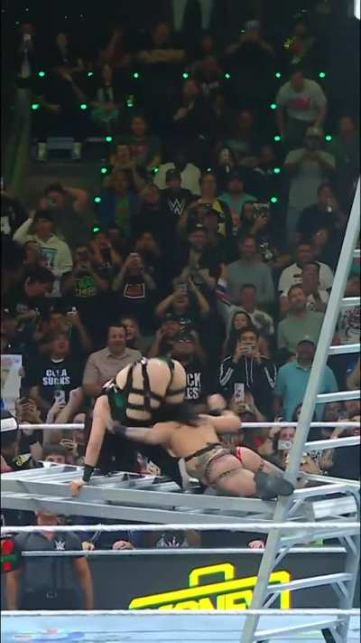 Rhea getting a devil's kiss from Stephanie