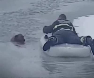 Heroic firefighter rescues dog from frozen lake