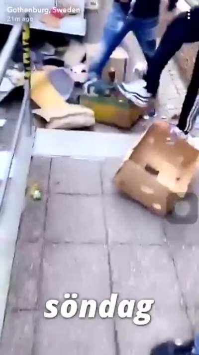 People looting someones moving truck at a BLM protest in Gothenburg, Sweden