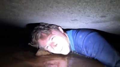 Crawling through a flooded cave
