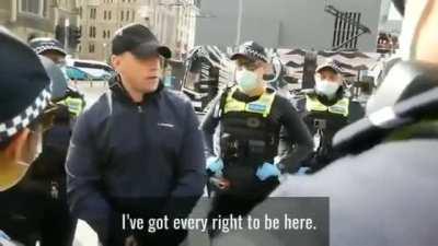 State of Australia. Man arrested for standing in the street.