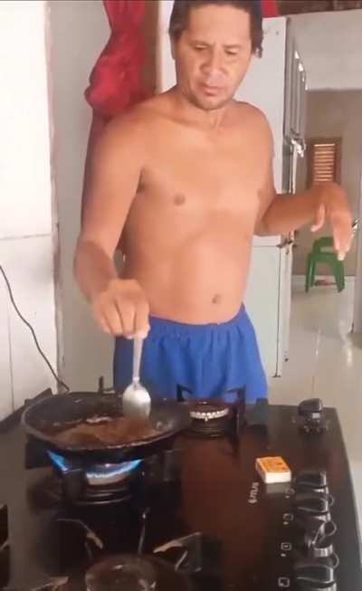 guy frying shirtless realizes it's a bad idea