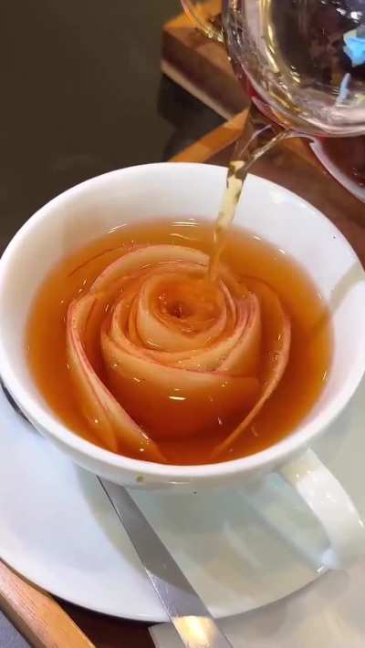At Oyoppi Cafe in Tokyo, the 'blooming apple tea' features thin apple slices that seemingly blossom as hot tea is poured over them.