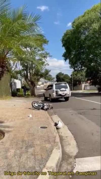 Biker probably didn't expect that the SUV driver would try to run him over