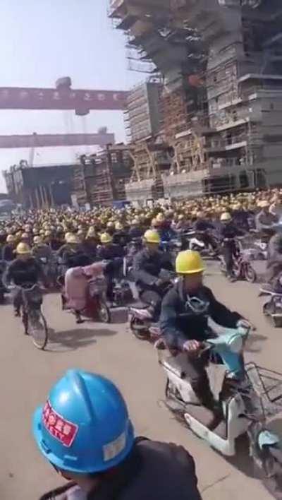 End of shift at a Jiangsu shipyard. This shows why China's ship and naval building is the tops in the world.