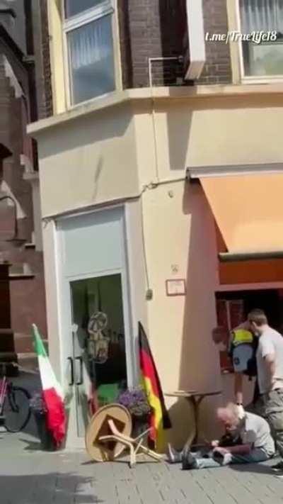 German police officer attacks old man for not wearing a mask.