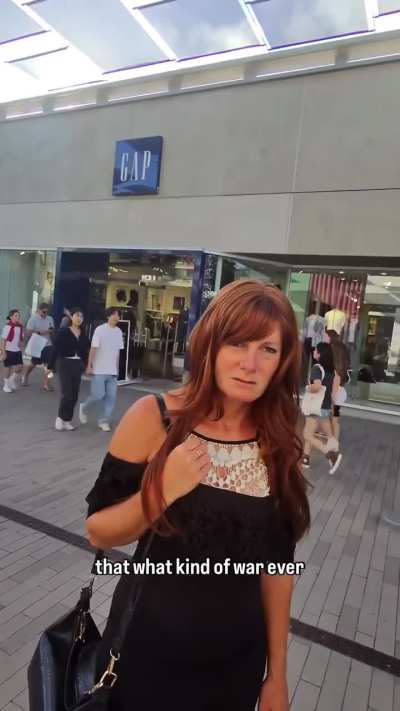 Woman being racist to cameraman, changes tone later