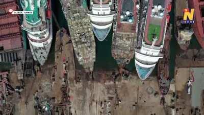 Drone view of a ship graveyard as cruising market collapses in pandemic