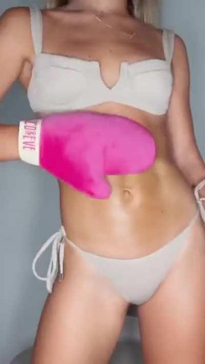 Rubbing herself down