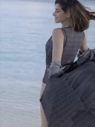 When she arrives near the gang she still is in mood of teasing so she starts revolving in middle of gang letting everyone get glimpse of her ass cheeks