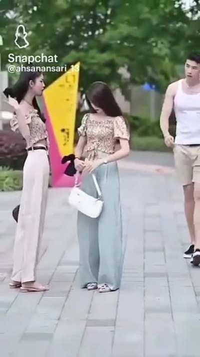 Two girls with identical dresses meet.