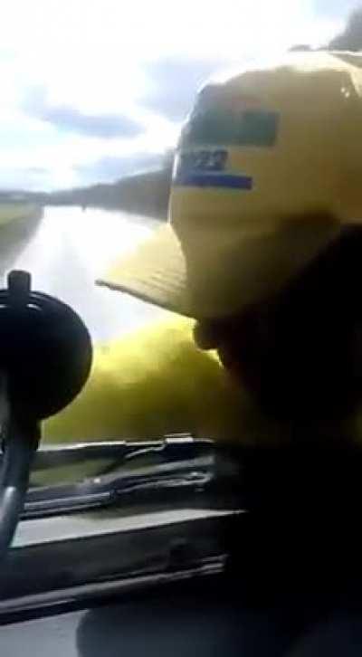 Bolsonaro’s supporter grabs truck to stop it. Driver doesn't care and takes him for a ride.