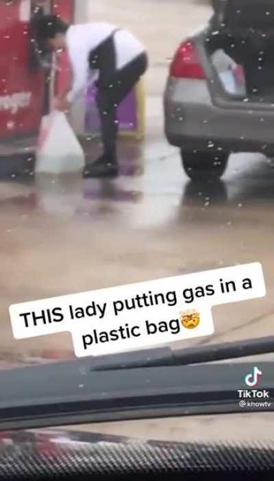 This lady putting gas in a bag