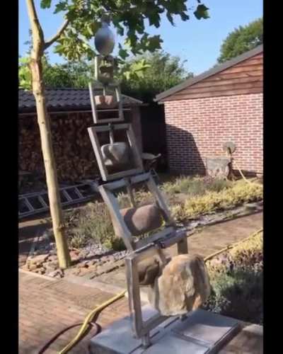 A kinetic sculpture, moving with the wind and balanced by science.