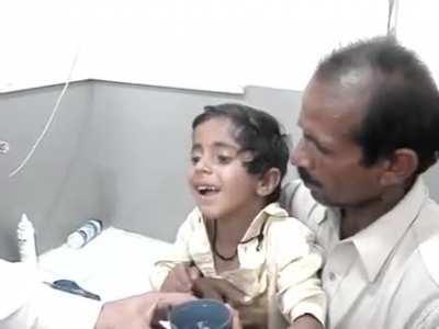 Child showing hydrophobia caused by rabies