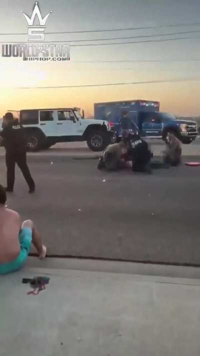 A shirtless man was filmed twerking on top of a Jeep moments before it crashed into another car on a Texas highway