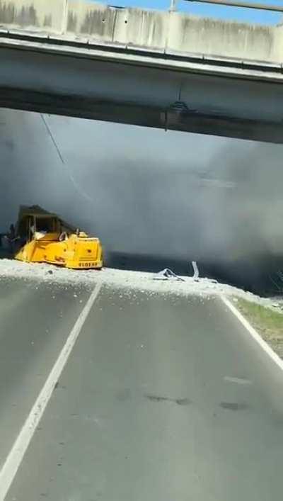 360 digger on a trailer hits overpass (1March 2022)