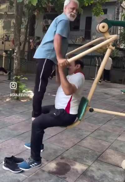 Just two normal uncle doing normal exercise at open gym