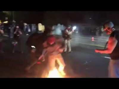 Portlands resident Antifa Clown 'Fire Shoes' does a dance for the crowd