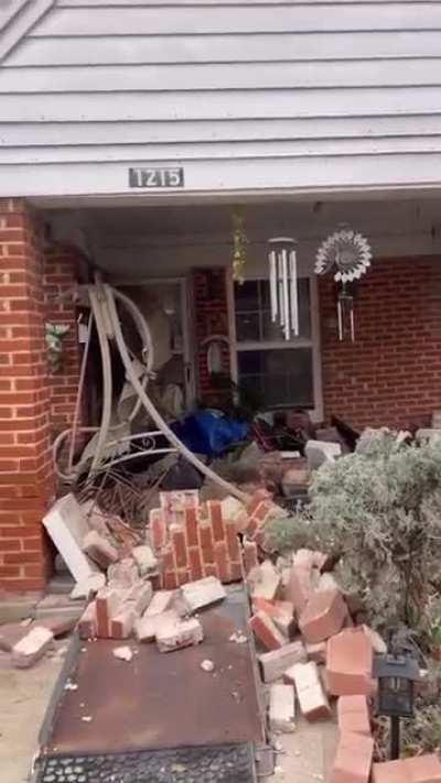 Neighbor in truck backed into my girlfriend's house this morning taking a brick pillar and porch swing with him.
