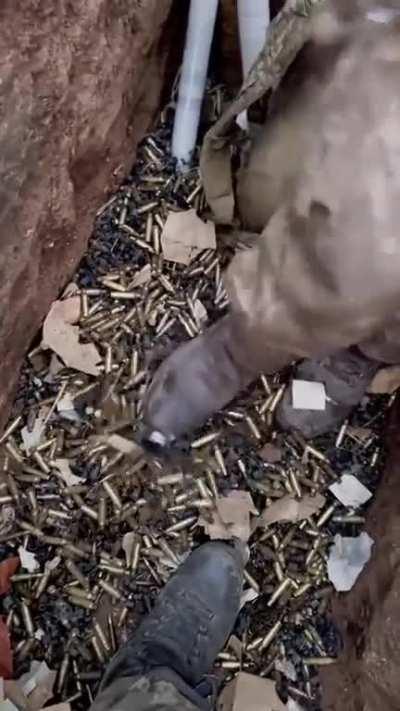Due to russia's endless human wave attacks Ukrainians have to dig deeper trenches... as the current ones are filling up with machine gun bullet casings
