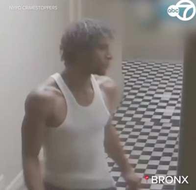 Woman makes it into her apartment just in time before a man tries to force his way in.