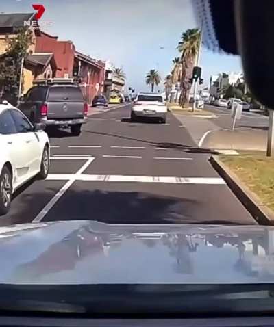 Road rager hits scooter driver with car, gets karma in return.