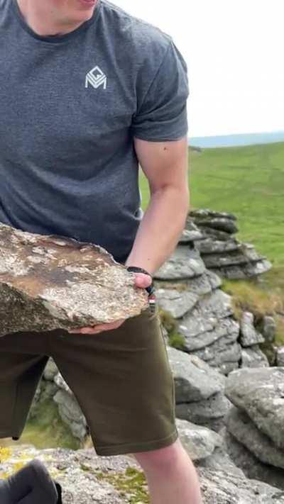 Dude throwing rock from top of bigger rock (slow-mo)