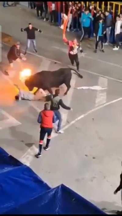 Bull humiliates guy by ripping his pants off, then shoves him around with his flaming horns, and finally turns him into a human windmill/propeller. 
