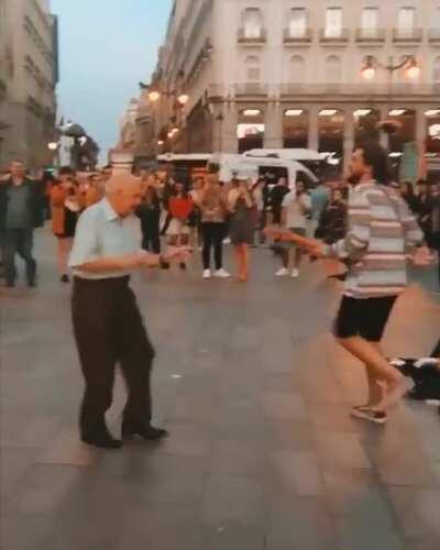 An amused old man dancing
