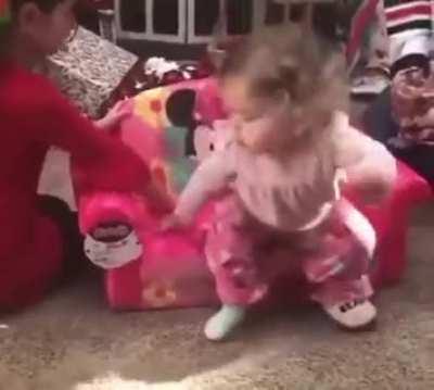 Little girl loving her new Minnie furniture