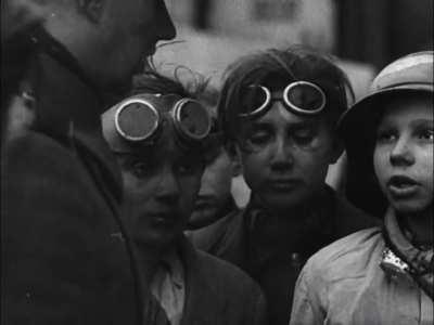 Young German Luftschutzhelfer covered in soot following an Allied bombing raid in 1944