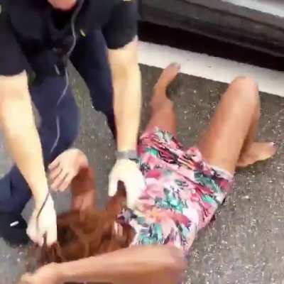 Jacksonville cop fights a woman and slams her face on the ground during an arrest.