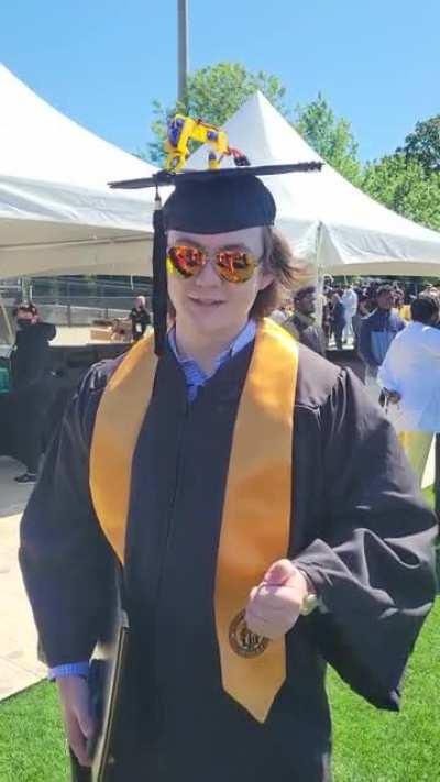 Graduated today with a silly robot on my cap!