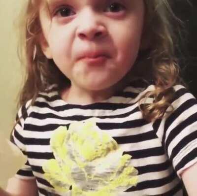 A Classic: Girl pretending to like mommy’s cooking