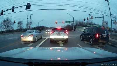Distracted driver runs red light