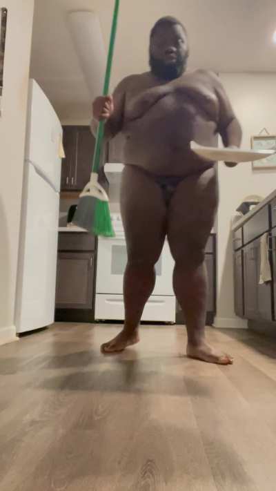 Sweeping up the kitchen.