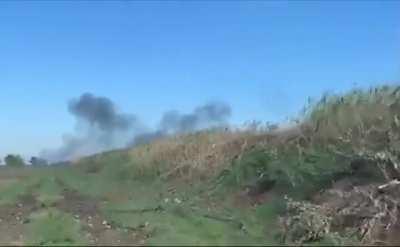 Ukrainian soldiers capturing and transporting POW in humvee while artillery landing in the background. Kherson - October 2022