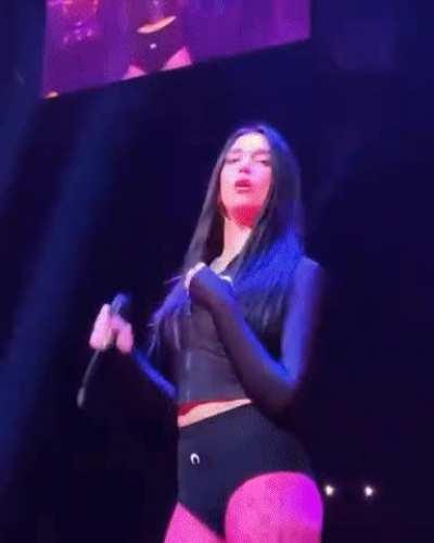 Dua Lipa. Unzipping her top on stage