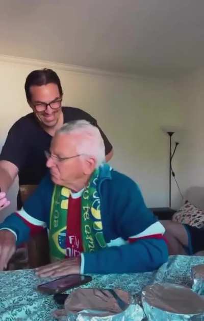 Son who lives abroad returns home and video calls his father