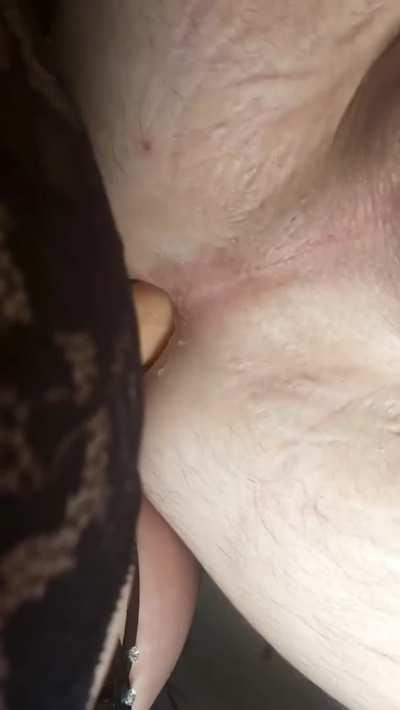 Close up of my dommy mommy gently rewarding me for being the goodest boy