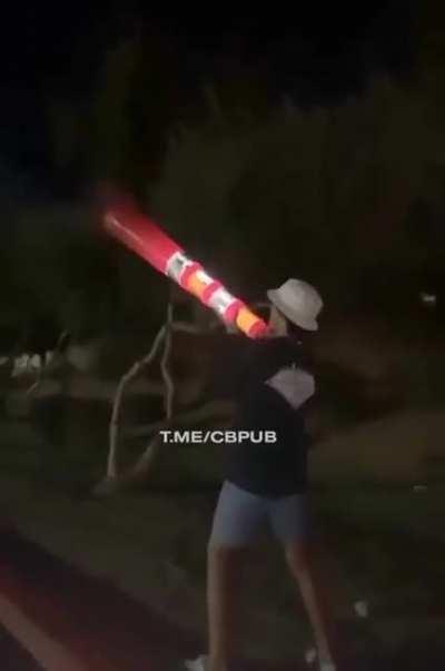 Putting fireworks in a traffic cone and holding it next to your face