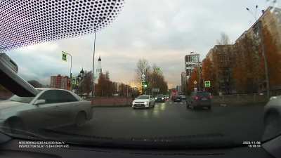 Dashcam driver distracted by talking on the phone blindly turns left.