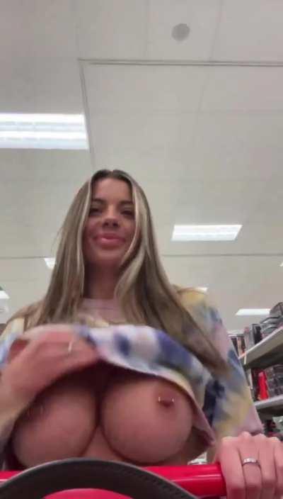 Shopping. Pierced huge tit reveal while shopping..