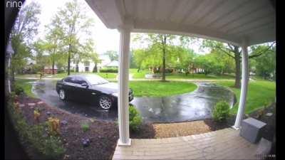 Leash tied to the house gets stuck on her car as she drives over it... resulting in some serious consequences.