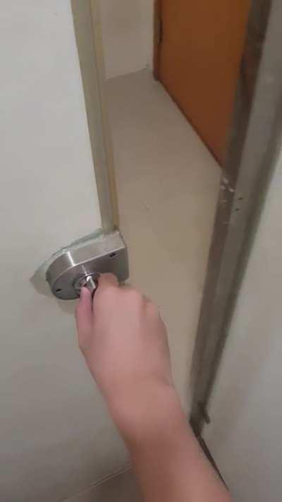A restroom door lock in a restaurant