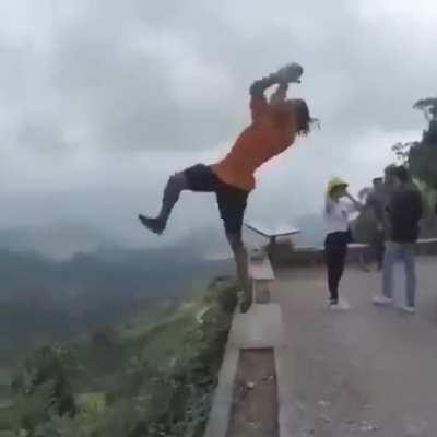 Backflipping on the edge of a cliff