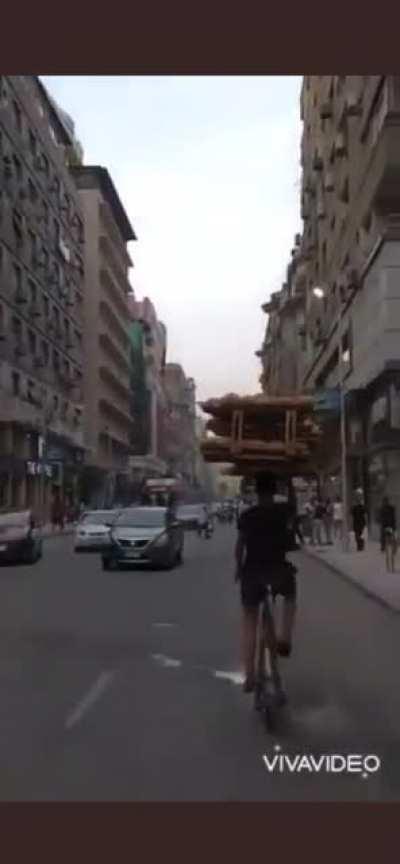 Filming the bread boy in middle of Cairo’s traffic.
